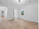 Bedroom with hardwood floors and access to hallway at 3417 Chilham Pl, Charlotte, NC 28226