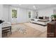 Main bedroom with hardwood floors, large bed and window at 3417 Chilham Pl, Charlotte, NC 28226