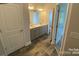 Double vanity bathroom with gray cabinets and tile flooring at 401 Imperial Way # 25, Albemarle, NC 28001