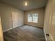 Bright bedroom featuring carpeted floors and a window at 401 Imperial Way # 25, Albemarle, NC 28001