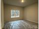 Bright bedroom with a window overlooking woods at 401 Imperial Way # 25, Albemarle, NC 28001