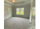 Spacious bedroom with gray carpet and large window at 401 Imperial Way # 25, Albemarle, NC 28001