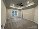 Large bedroom with ceiling fan and window at 401 Imperial Way # 25, Albemarle, NC 28001