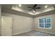 Spacious bedroom with ceiling fan and large window at 401 Imperial Way # 25, Albemarle, NC 28001