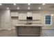 Modern kitchen with white cabinets, granite countertops, and stainless steel appliances at 401 Imperial Way # 25, Albemarle, NC 28001