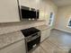 Modern kitchen with white cabinets, granite countertops, and stainless steel appliances at 401 Imperial Way # 25, Albemarle, NC 28001