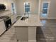 Kitchen island with granite countertop and stainless steel sink at 401 Imperial Way # 25, Albemarle, NC 28001