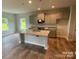 Modern kitchen with gray cabinets, granite countertops, and an island at 401 Imperial Way # 25, Albemarle, NC 28001