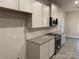 Modern kitchen with white cabinets, granite countertops, and stainless steel appliances at 401 Imperial Way # 25, Albemarle, NC 28001