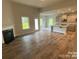 Spacious living room featuring hardwood floors and a fireplace at 401 Imperial Way # 25, Albemarle, NC 28001