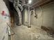 Unfinished mechanical room with HVAC and sump pump at 401 Imperial Way # 25, Albemarle, NC 28001