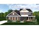 Charming two-story home with brown shutters and a covered porch, showcasing a blend of modern farmhouse design at 4615 Yellow Poplar Ln, Concord, NC 28025