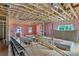 Unfinished room interior with ladder, lumber, and exposed beams and insulation at 4615 Yellow Poplar Ln, Concord, NC 28025