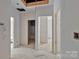 Bathroom view showcasing an open floor plan with multiple entrances and plumbing throughout at 4641 Yellow Poplar Ln, Concord, NC 28025