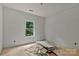 An unfinished bedroom with a bright window offers a glimpse of nature at 4641 Yellow Poplar Ln, Concord, NC 28025