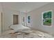 An unfinished bedroom features multiple windows offering ample natural light and scenic views at 4641 Yellow Poplar Ln, Concord, NC 28025