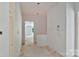 Unfinished hallway with drywall and doorways leading to different rooms at 4641 Yellow Poplar Ln, Concord, NC 28025