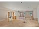 Unfinished large living room area with drywall, natural light, and structural framework at 4641 Yellow Poplar Ln, Concord, NC 28025
