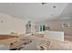 Spacious living room area featuring natural light from the windows and a walkout to the backyard at 4641 Yellow Poplar Ln, Concord, NC 28025