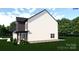 Angle view of a white two-story house with a side entry garage and well-manicured lawn at 4641 Yellow Poplar Rd, Concord, NC 28025