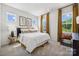 Spacious bedroom with large windows and mustard yellow accents at 1194 Lost Cove Rd, Indian Land, SC 29707