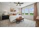 Bright bedroom with large windows, neutral decor, and ceiling fan at 1194 Lost Cove Rd, Indian Land, SC 29707