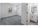 Bedroom with gray carpet, window, and en-suite bathroom at 1194 Lost Cove Rd, Indian Land, SC 29707