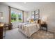 Bedroom with herringbone patterned wall and natural light at 1194 Lost Cove Rd, Indian Land, SC 29707