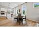 Casual dining area adjacent to kitchen, featuring round wooden table and black chairs at 1194 Lost Cove Rd, Indian Land, SC 29707