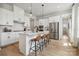 Modern kitchen with white cabinetry, stainless steel appliances, and an island at 1194 Lost Cove Rd, Indian Land, SC 29707