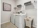 Bright laundry room with washer, dryer, and ample shelving at 1194 Lost Cove Rd, Indian Land, SC 29707