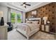 Spacious main bedroom with large windows and geometric wallcovering at 1194 Lost Cove Rd, Indian Land, SC 29707