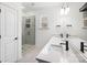 Bathroom with double vanity, glass shower, and white cabinets at 1198 Lost Cove Rd, Indian Land, SC 29707