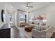 Bright living room with beige sofa and large windows at 1198 Lost Cove Rd, Indian Land, SC 29707