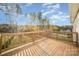 Inviting back deck offering views of the landscaped backyard and fall foliage at 159 Rubys Way # 35, Oakboro, NC 28129