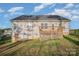 Back exterior view showcasing the deck and access to the backyard at 159 Rubys Way # 35, Oakboro, NC 28129