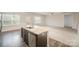 Modern kitchen island with granite countertops, stainless steel dishwasher, and hardwood floors at 159 Rubys Way # 35, Oakboro, NC 28129