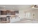 Modern kitchen featuring stainless steel appliances, granite countertops, and dark wood cabinetry at 159 Rubys Way # 35, Oakboro, NC 28129
