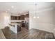 Bright kitchen featuring stainless steel appliances, granite countertops, and dark cabinetry at 159 Rubys Way # 35, Oakboro, NC 28129