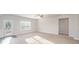 Bright and airy living room featuring neutral tones, a ceiling fan, a window, and a door at 159 Rubys Way # 35, Oakboro, NC 28129