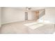 An open and spacious living room with carpeted flooring and a staircase at 159 Rubys Way # 35, Oakboro, NC 28129