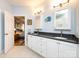 Double vanity bathroom with granite countertop and large mirrors at 1801 Brandywine Dr, Matthews, NC 28105