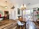 Dining area with hardwood floors and a chandelier at 1801 Brandywine Dr, Matthews, NC 28105