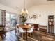 Bright dining room with hardwood floors and mid-century modern furniture at 1801 Brandywine Dr, Matthews, NC 28105