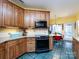 Kitchen with stainless steel appliances and wood cabinets at 1801 Brandywine Dr, Matthews, NC 28105