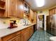 Kitchen boasts wood cabinets, granite counters, and stainless steel appliances at 1801 Brandywine Dr, Matthews, NC 28105