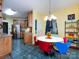 Eat-in kitchen with colorful table and chairs, and access to the patio at 1801 Brandywine Dr, Matthews, NC 28105