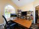 Home office with large window, desk, and shelving at 1801 Brandywine Dr, Matthews, NC 28105