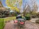 Small patio with metal table and chairs at 1801 Brandywine Dr, Matthews, NC 28105