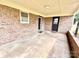 Covered back porch features brick wall and two entrances for access to the backyard at 1905 26Th Ne St, Hickory, NC 28681